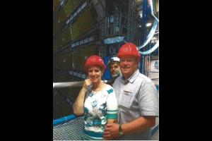 Alan clinging onto his wife on the gantry